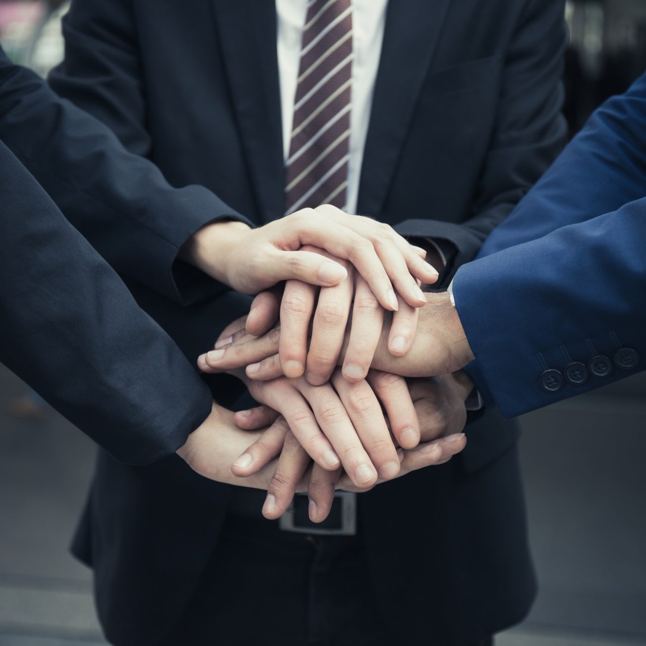 Group of Business.Team with hands together. People with business team stacking hands together.